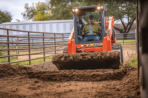 Man driving skid steer